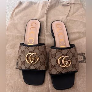 Gucci monogram and black leather slides